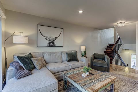 Open living area with lake views, dining space, and direct access to the waterfront deck.
