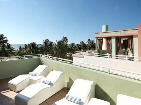 Soak up sunshine on the terrace with plush loungers.