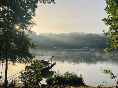 The water depth at the dock remains approximately 20–25 feet