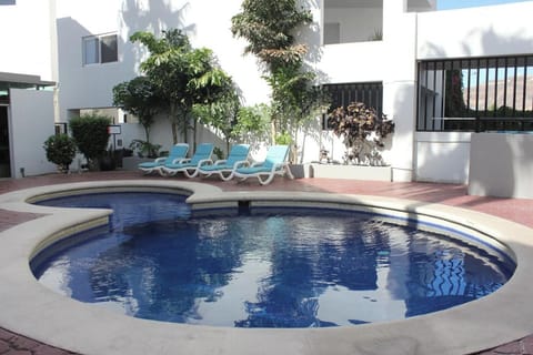 Soak up the day beside the sparkling pool and loungers.