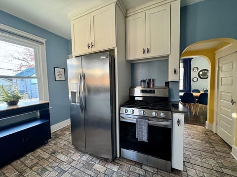 The Main Level Kitchen offers Full size side-by-side refrigerator and range, pantry, and easy access to the Dining Room.