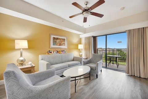 Relax in the spacious living room with balcony views
