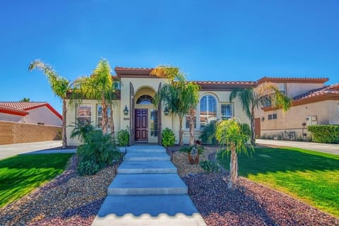 A beautifully landscaped stairway leads you to the front door.