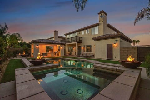 A view of the backyard from the spa during sunset!