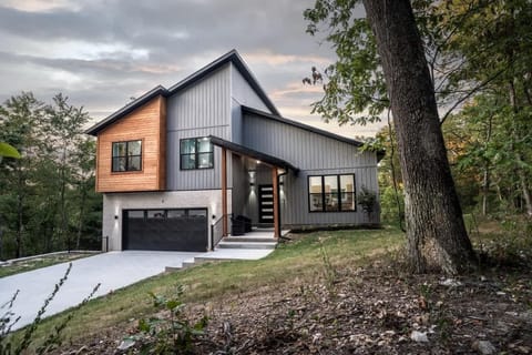 Twilight exterior showing garage and driveway