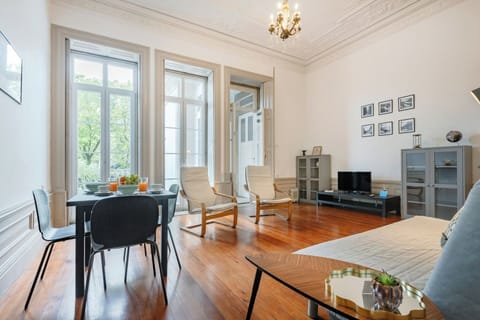 The bright living room includes a sofa-bed, armchairs, TV and dining table for 4.
Opens onto the balcony.