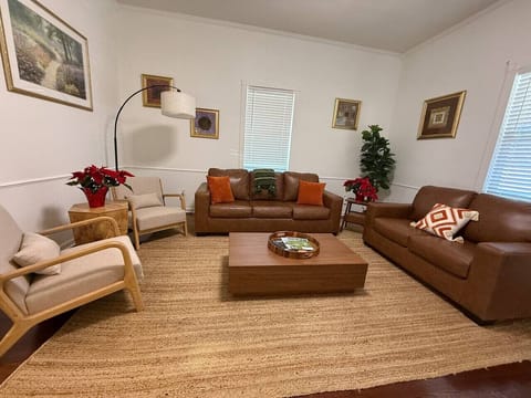 The living room offers ample seating, a 55” Smart TV, and a quiet environment ideal for relaxing after exploring the area.