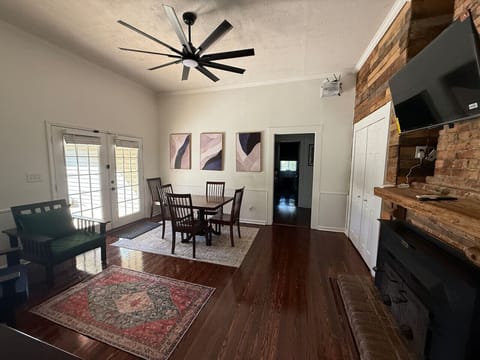 You’ll love the dining area for four with French doors leading to a large deck and big fenced backyard—ideal for gathering and relaxing.