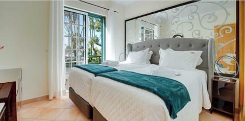 Unwind in a serene room with plush pillows and soft throws.