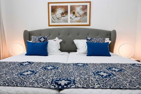 Sink into the cushioned headboard and freshly made bed.