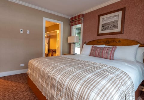 Recharge in a calm bedroom with warm textures and quiet views.