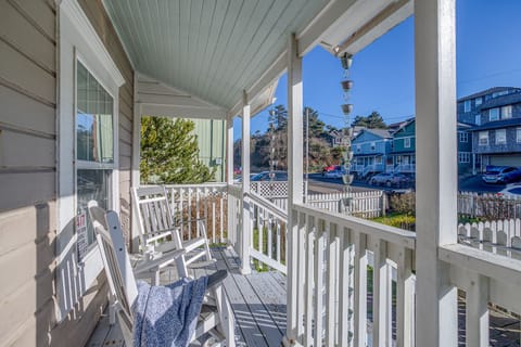 Settle into your private covered porch with cozy rocking chairs, perfect for morning coffee while enjoying peaceful neighborhood views.