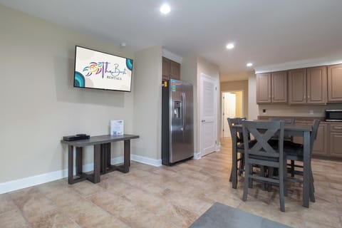 Your open-concept kitchen flows seamlessly into a welcoming dining area, perfect for gathering over meals while catching up on shows.