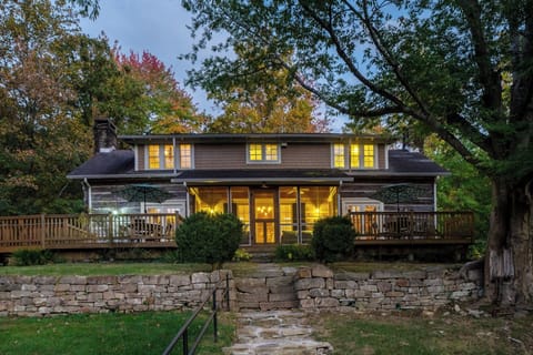 Arrive at dusk to glowing windows and serene decks.