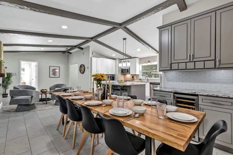 Kitchen table that can seat up to 10 people comfortably (a folding card table & 4 chairs are in the master bedroom closet and 3 more spots at the bar for a total of 17).