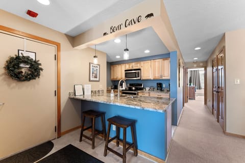Full kitchen with breakfast bar.