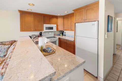 Unit 1 Equipped kitchen with full-size appliances.