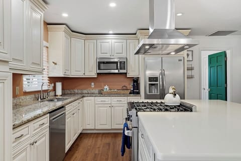 Your gourmet kitchen awaits with granite counters, stainless appliances, and gas range—perfect for creating memorable meals together.