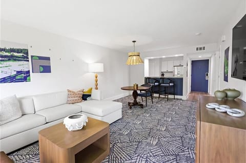 Unwind together in a spacious living room that blends relaxation with modern elegance.