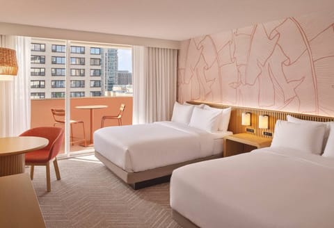 Wake up to sunshine, balcony breezes, and plush double beds.