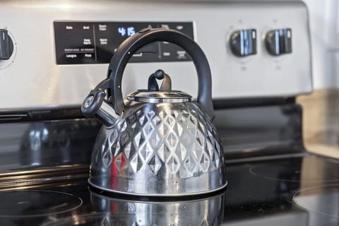 Clean and modern kitchen with stainless steel appliances.