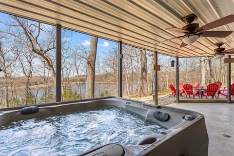 Lower Patio with Hot Tub, Seating, and a Great Lake View
