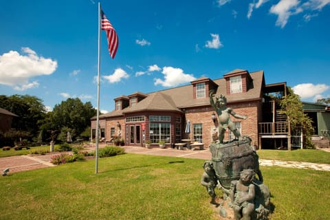 Mesina Hof Winery exterior with landscaped gardens nearby