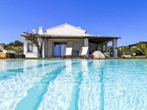 Blue, Swimming Pool, Resort, Outdoor Furniture, Leisure, Shade, Eco Hotel, Landscaping, Umbrella, Estate