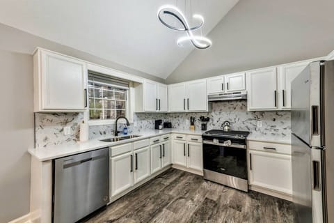 Kitchen with Granite countertops and backsplash