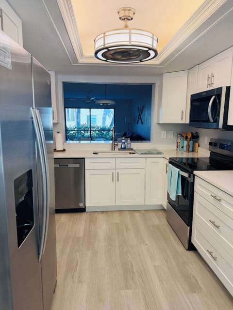 Large kitchen pass-through into dining and living spaces.