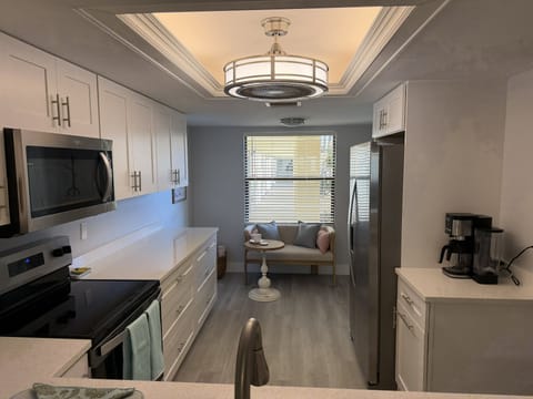 View through the kitchen pass-through into this cute little breakfast nook.