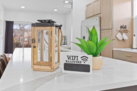 Bright kitchen island styled with modern décor and ample prep space. A welcoming centerpiece perfect for morning coffee, casual meals, or gathering while cooking.