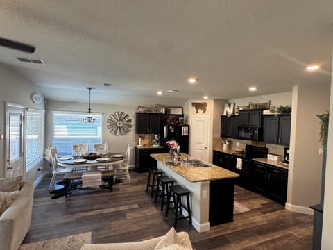 The kitchen is fully equipped with essential appliances, cookware, and utensils.