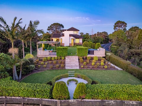 View from the back garden towards the back of the house.  The property has a lot of landscaping