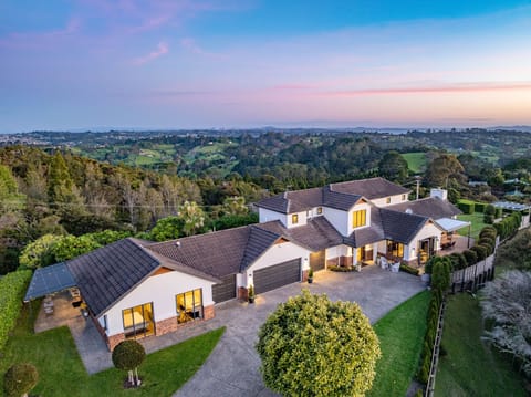 View from above the driveway of the entire front of the property, including the 2bdr Guest Huse
