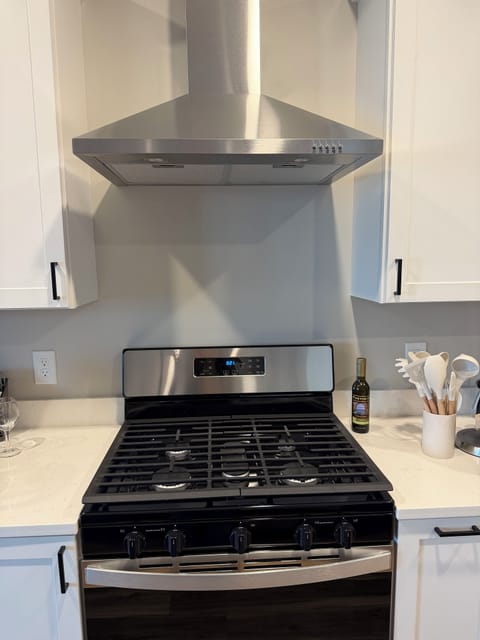 Kitchen with natural gas stove. 