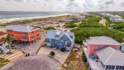 Afterglow on the Gulf is the blue home centered in this photo.