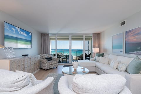 Relax in your oceanfront living room with stunning sea views through floor-to-ceiling windows and your private balcony awaiting.