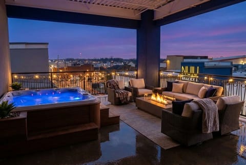 Soak in the bubbling hot tub or gather around the glowing square fire pit on our private penthouse terrace. The dark wicker sectional offers the best seat to take in those stunning city views.