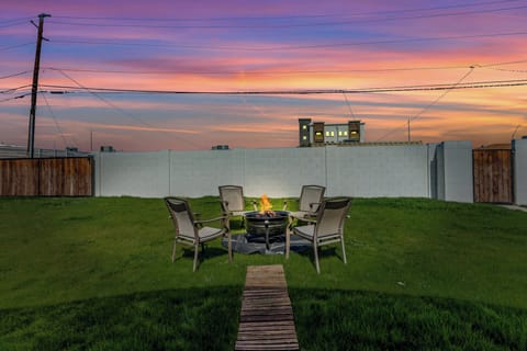 Large private backyard with open space and a comfortable patio area, perfect for relaxing outdoors and enjoying fresh air during your stay.