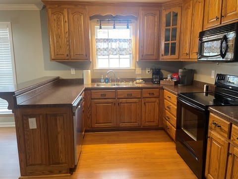 Kitchen with dishwasher and ample counter space.