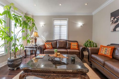 Large windows allow plenty of natural light to flood our living room, creating a welcoming and comfortable atmosphere.