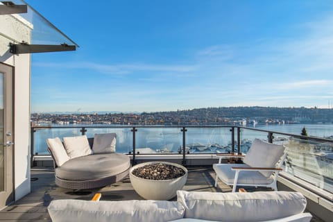 An elevated stay with panoramic views of the water and city.