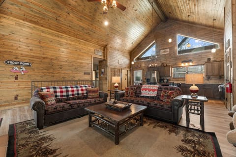 Living Space with Cozy Furniture, Fireplace, Cable TV, a Dedicated Workspace and Deck Access