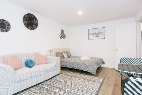 Queen-sized bed, couch, dining table 
