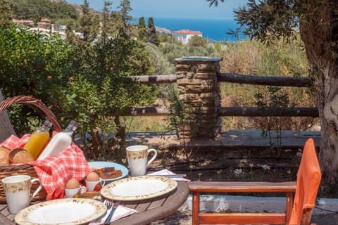Outdoor area surrounded by greenery where guests can enjoy relaxed outdoor meals with family or friends.