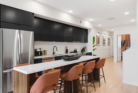 Fully equipped, modern kitchen for all of your cooking needs! Has a kitchen island with dining seating for 8.