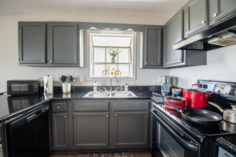 Unit A's full kitchen has plenty of natural lighting to enjoy slow mornings while sipping your coffee!
