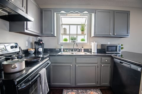 Unit B's full kitchen has plenty of natural lighting to enjoy slow mornings while sipping your coffee!