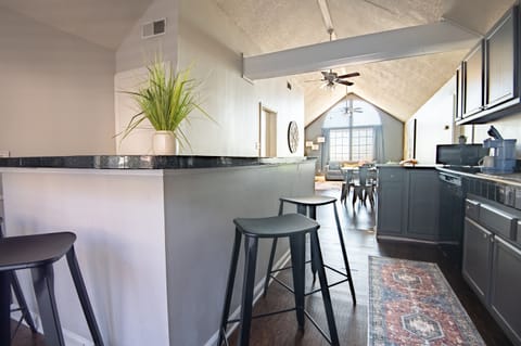 The bar area has plenty of extra seating for your convenience and comfort. Enjoy cooking up your favorite meals here or doing some work at this laptop friendly area.